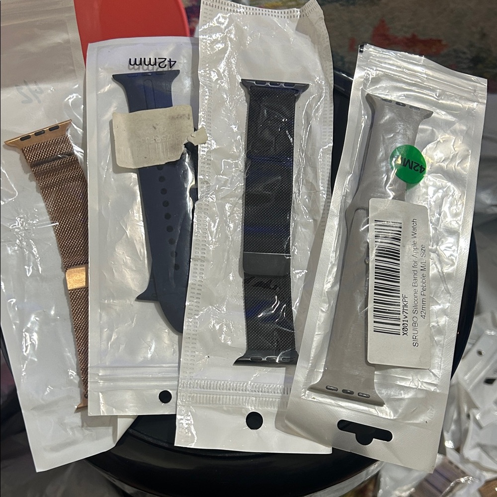 Assorted apple Watch Bands in Gold, Blue, and Gray & black